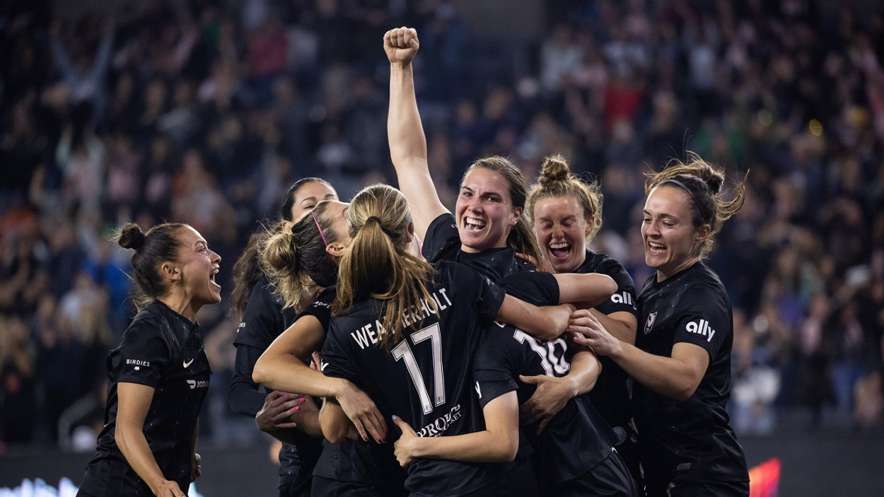 angel-city-football-club-s-vanessa-gilles-center-surrounded-by-team-mates-including-from-left-ali-riley-dani-weatherholt-savannah-mccaskill-and-megan-reid