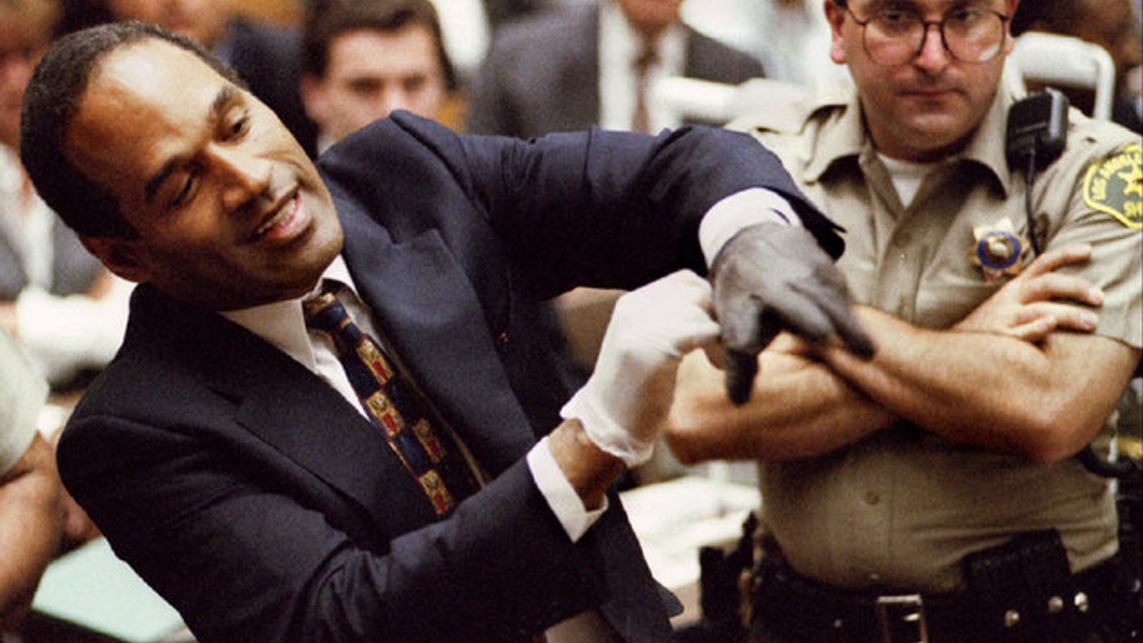 Defendant OJ Simpson wearing one the blood stained gloves found by Los Angeles Police and entered in..