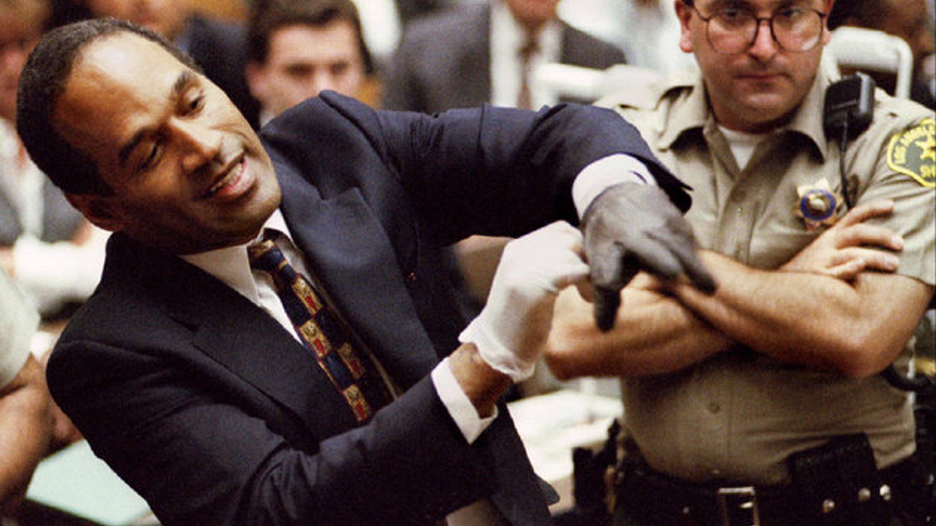 Defendant OJ Simpson wearing one the blood stained gloves found by Los Angeles Police and entered in..
