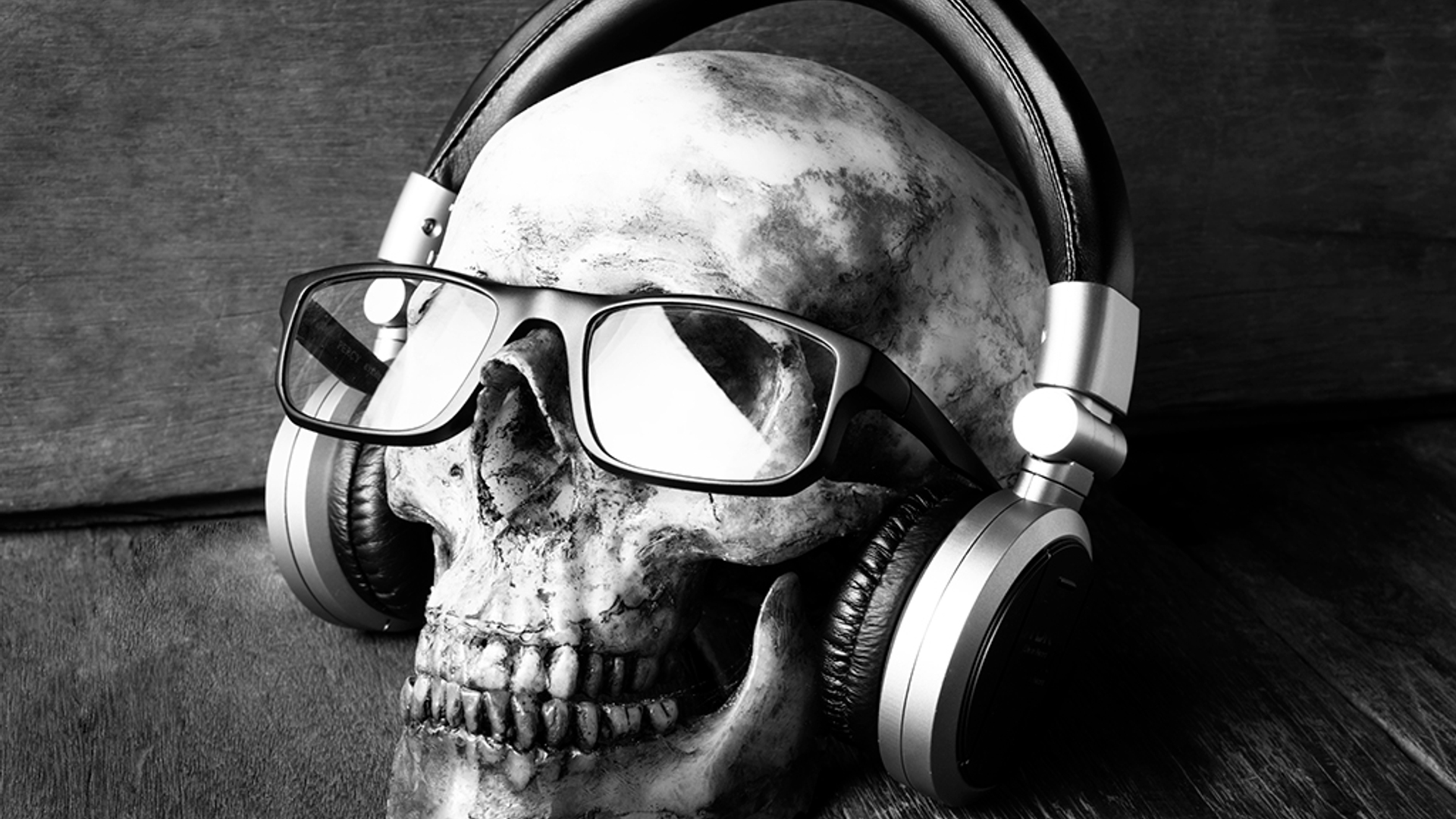 Dead Skull Listening to Music Black and white